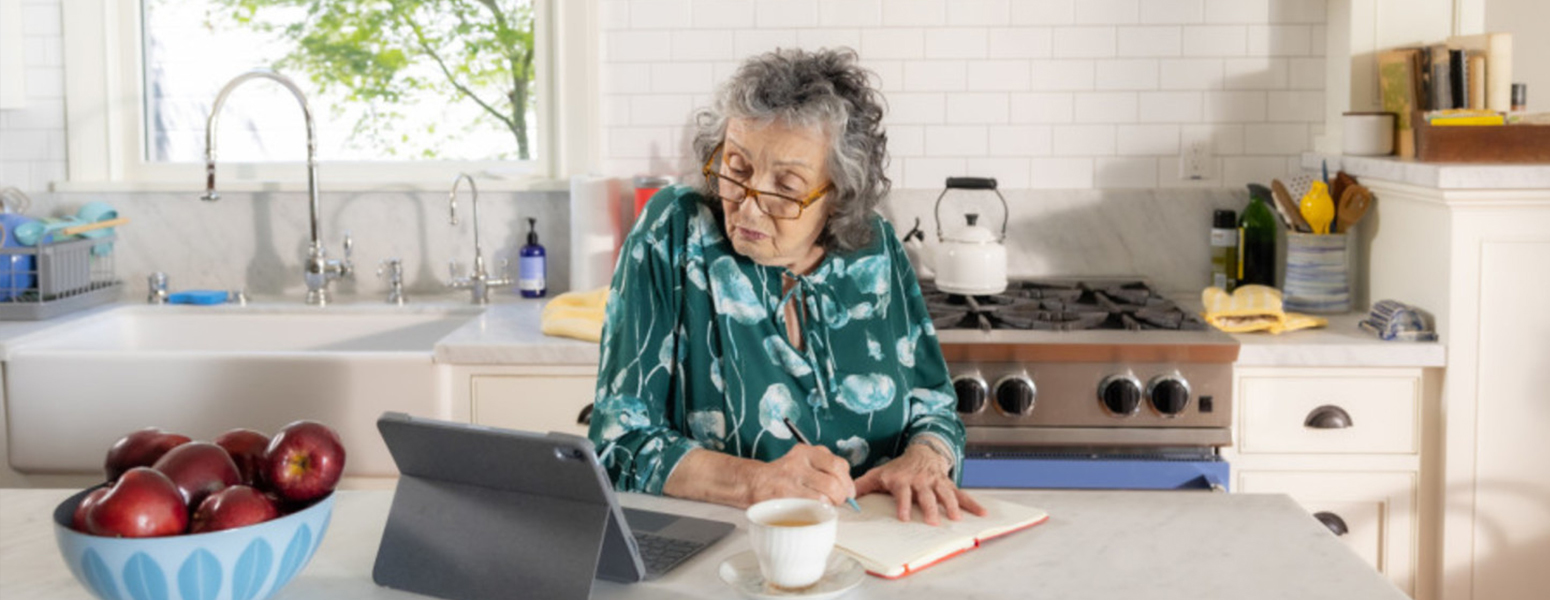 Women reading about home sustainability tips