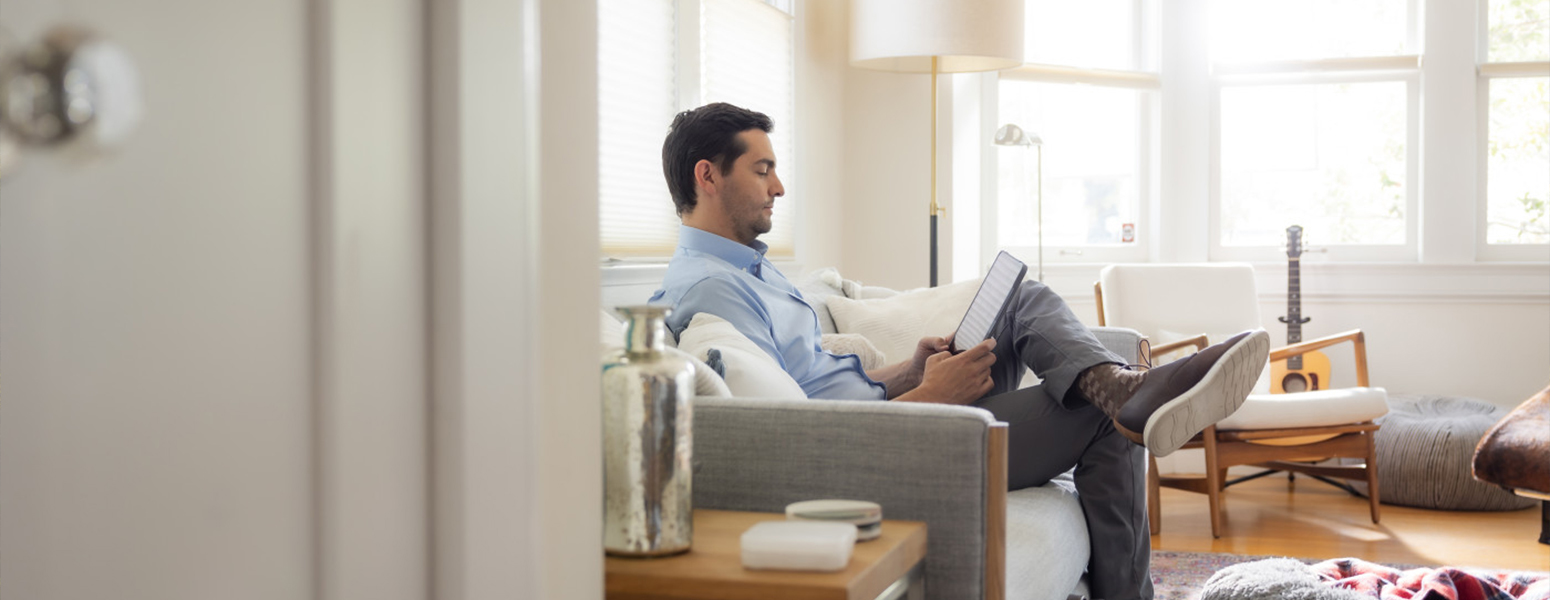 Man using a device in his home